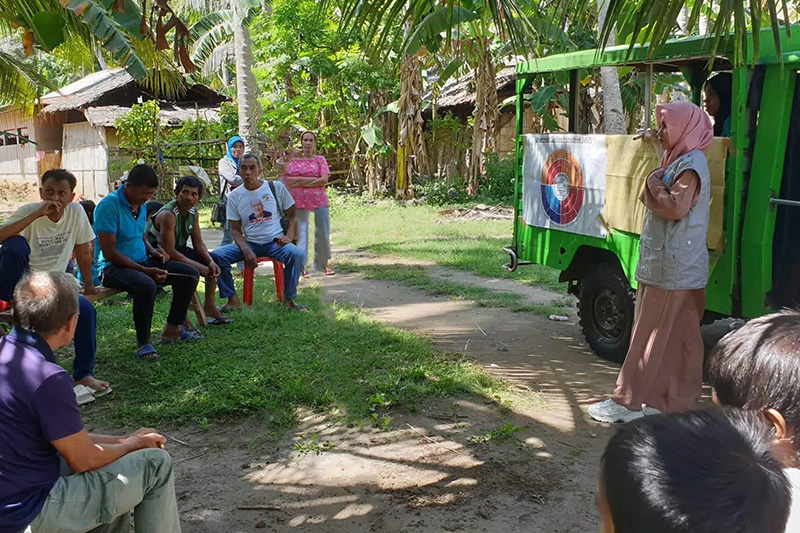 UCP Practitioner talking to locals